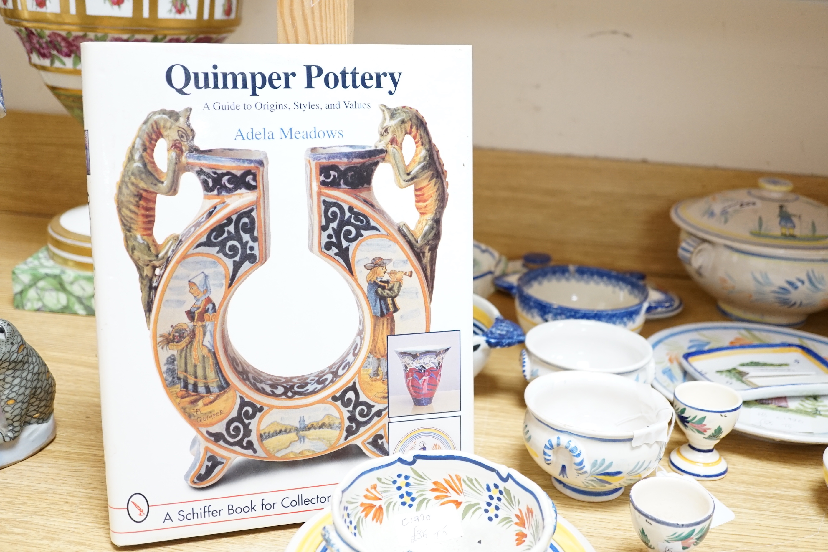 A group of Quimper pottery and a Quimper Pottery book by Angela Meadows